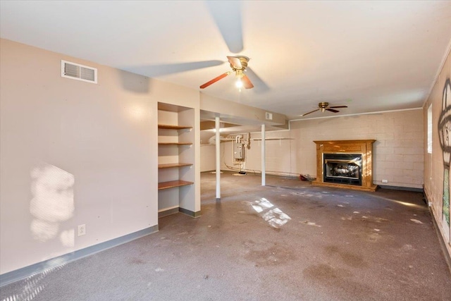 unfurnished living room featuring ceiling fan