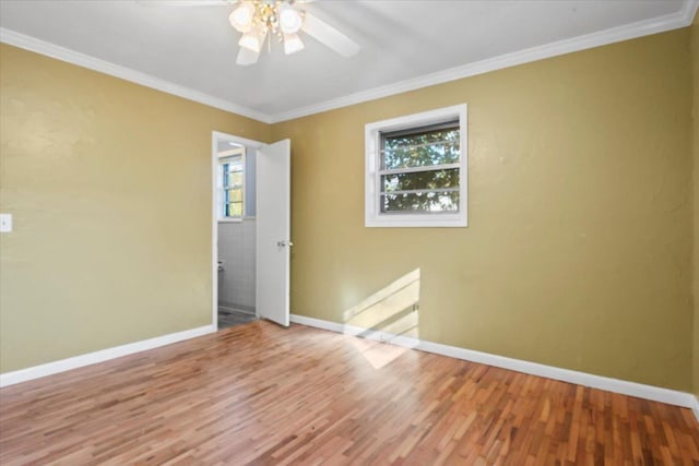 unfurnished room with hardwood / wood-style flooring, ceiling fan, and crown molding