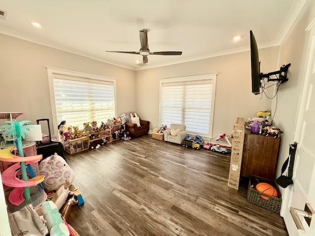  - game room featuring ceiling fan, ornamental molding, wood finished floors, and recessed lighting