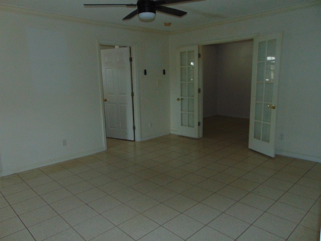 tiled spare room with ceiling fan, french doors, and crown molding