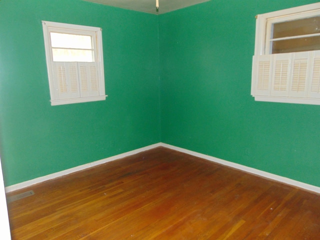 spare room featuring hardwood / wood-style flooring