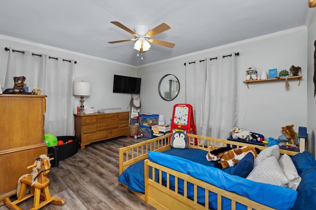 bedroom with dark wood-type flooring, ceiling fan, and ornamental molding