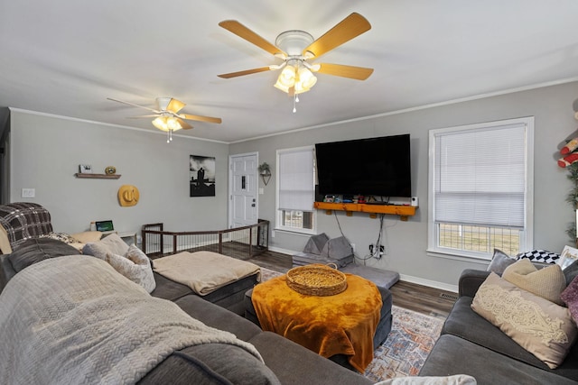 living room featuring ornamental molding, dark hardwood / wood-style floors, and ceiling fan