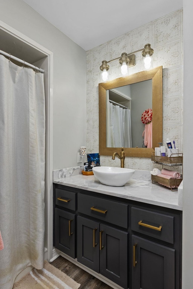 bathroom featuring vanity and hardwood / wood-style floors