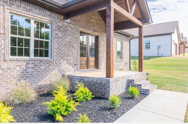 entrance to property with a yard