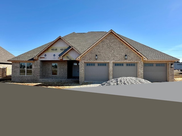 view of front of property featuring a garage