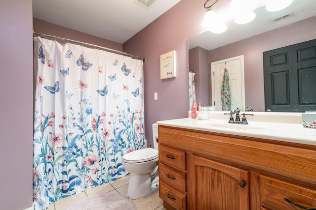  - bathroom with tile patterned floors, vanity, toilet, and visible vents