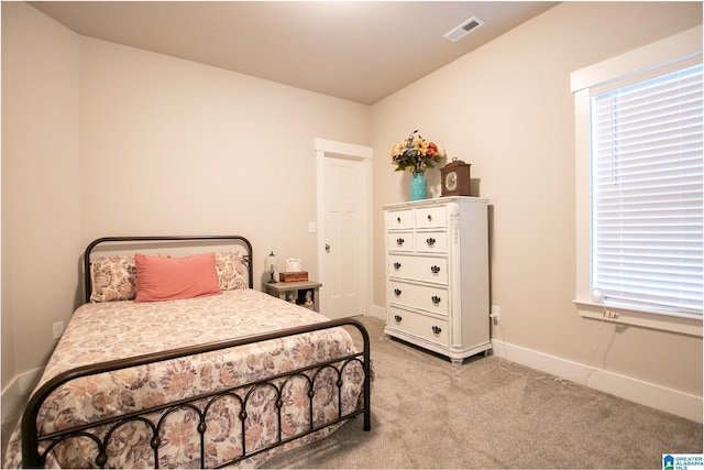  - carpeted bedroom with baseboards
