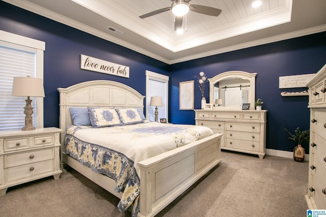 - carpeted bedroom featuring a raised ceiling, crown molding, and ceiling fan