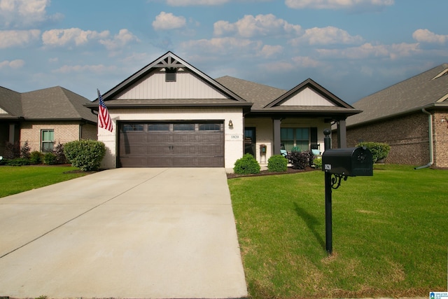  - view of front of home with an attached garage, a front yard, concrete driveway, and brick siding