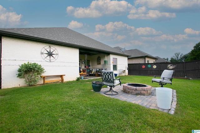  - view of yard with an outdoor fire pit and a patio