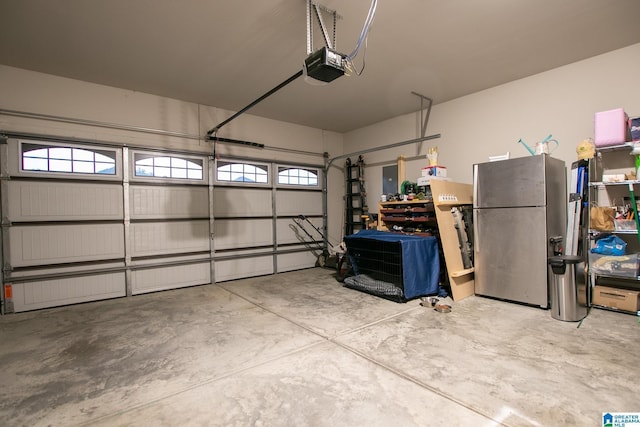  - garage with freestanding refrigerator and a garage door opener
