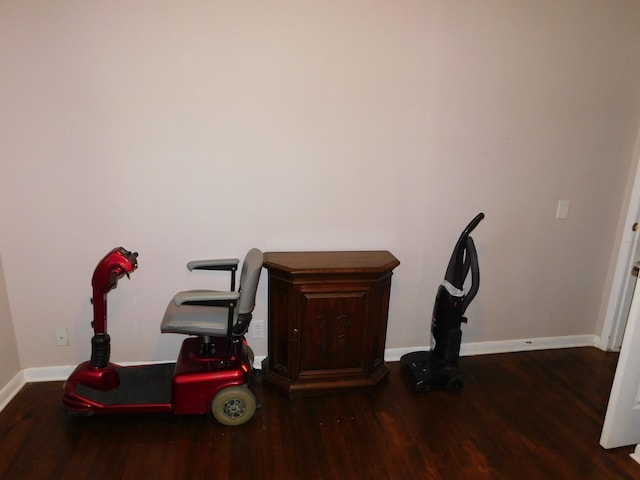 office space featuring baseboards and wood finished floors