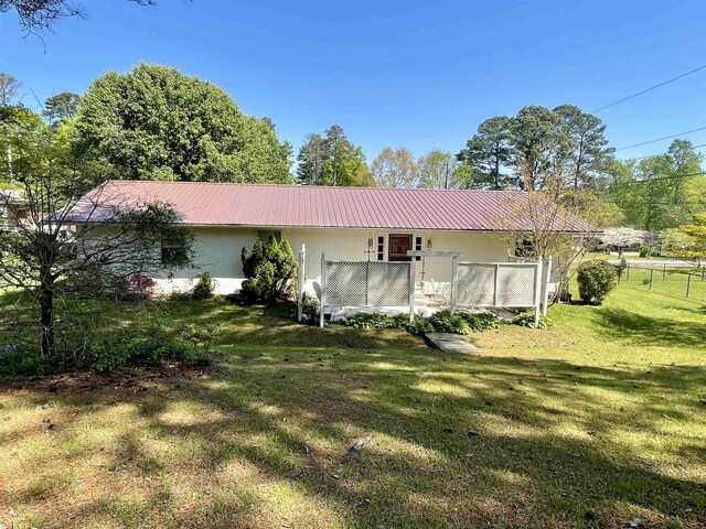  - rear view of house with metal roof