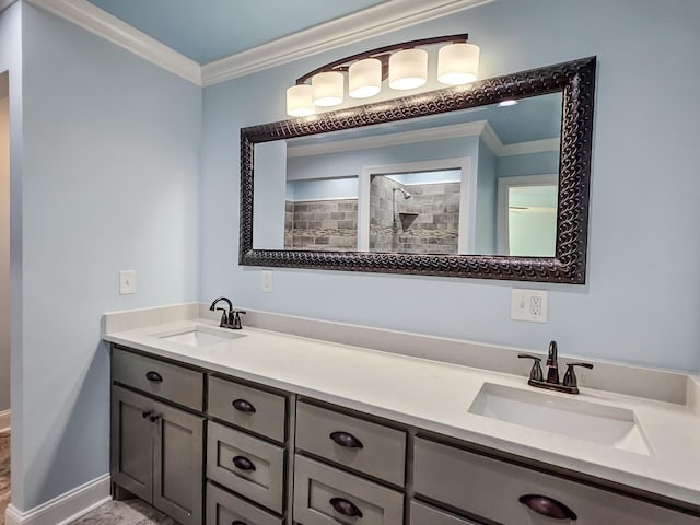 bathroom with a shower, vanity, and ornamental molding