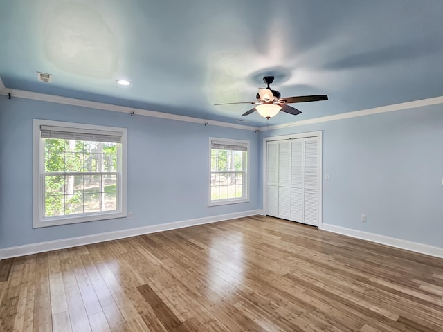 spare room with ceiling fan, light hardwood / wood-style floors, and ornamental molding