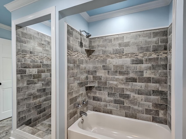 bathroom with tiled shower / bath combo and crown molding