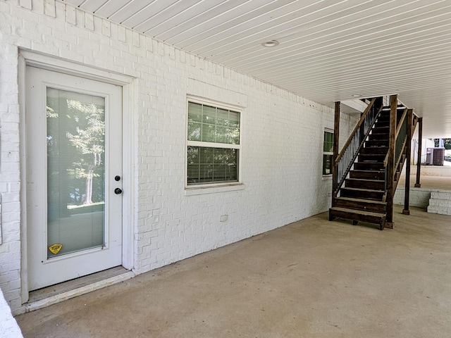 doorway to property featuring central AC