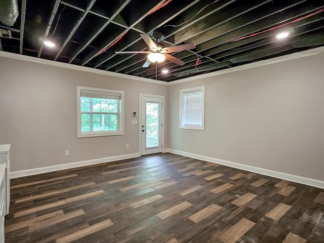 foyer entrance featuring ceiling fan, dark hardwood / wood-style floors, and ornamental molding