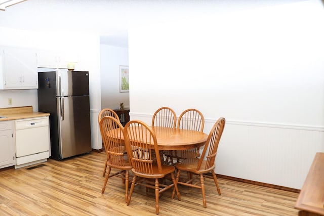 dining space featuring light hardwood / wood-style flooring