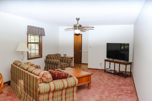 carpeted living room featuring ceiling fan