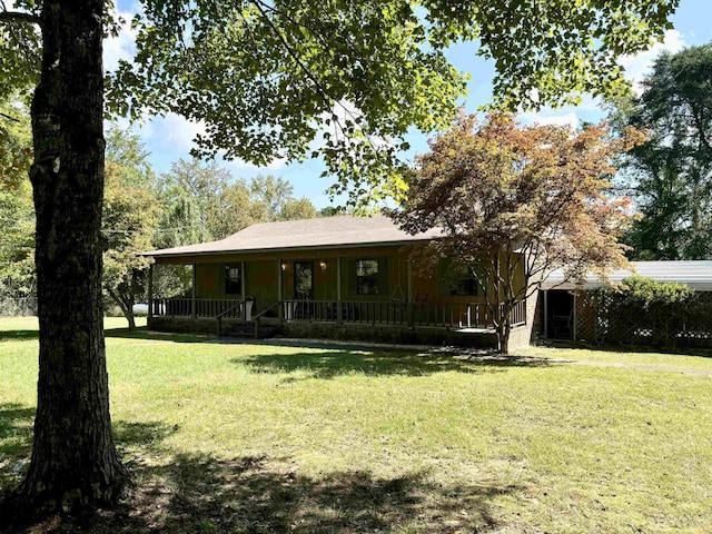 farmhouse inspired home with a porch and a front yard