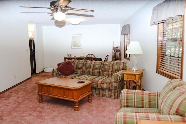 living room featuring carpet flooring and ceiling fan