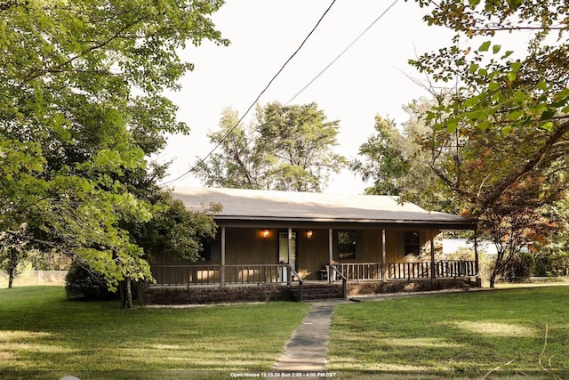 country-style home with covered porch and a front yard