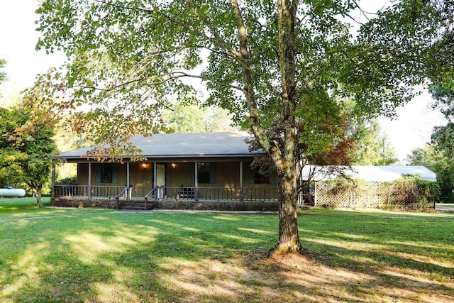 single story home with covered porch and a front yard