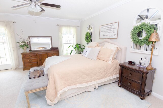 bedroom with ceiling fan, light colored carpet, and ornamental molding