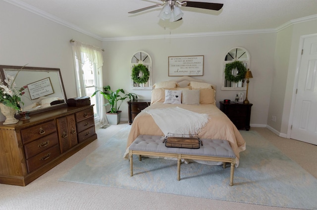 bedroom featuring light carpet, ceiling fan, and crown molding