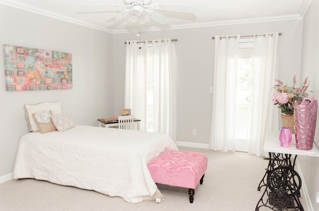 bedroom with multiple windows, carpet floors, ceiling fan, and crown molding