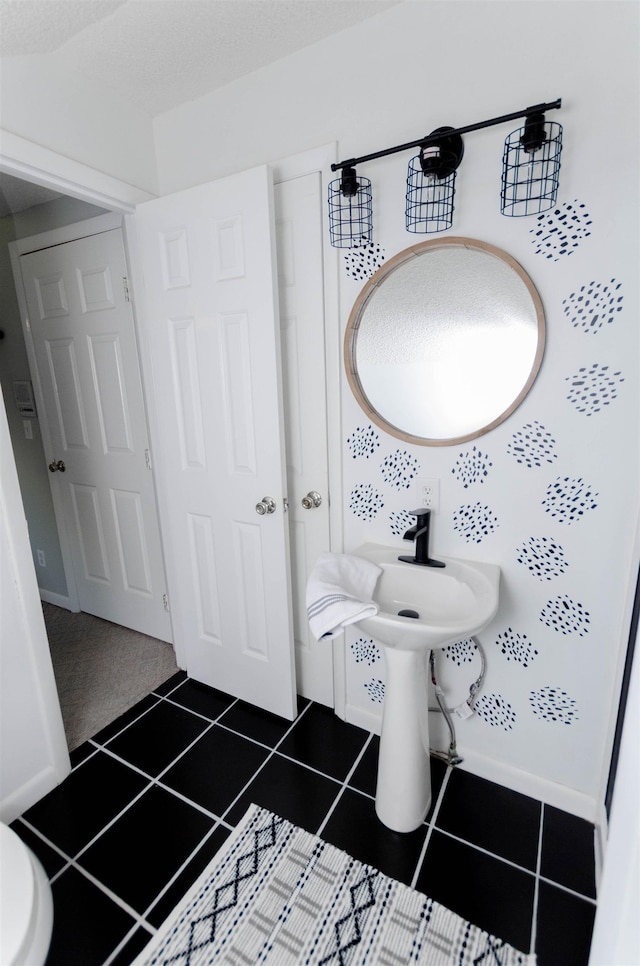 bathroom with tile patterned floors