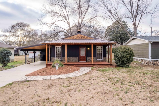 farmhouse-style home with a carport and a porch