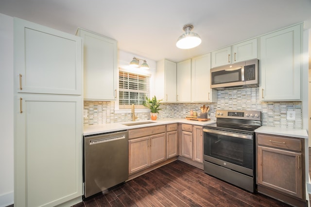 kitchen featuring white cabinetry, sink, and appliances with stainless steel finishes