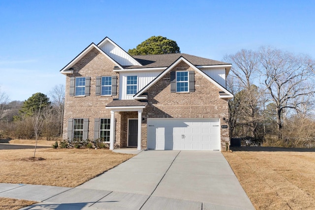 view of front of house featuring driveway, a front lawn, and brick siding