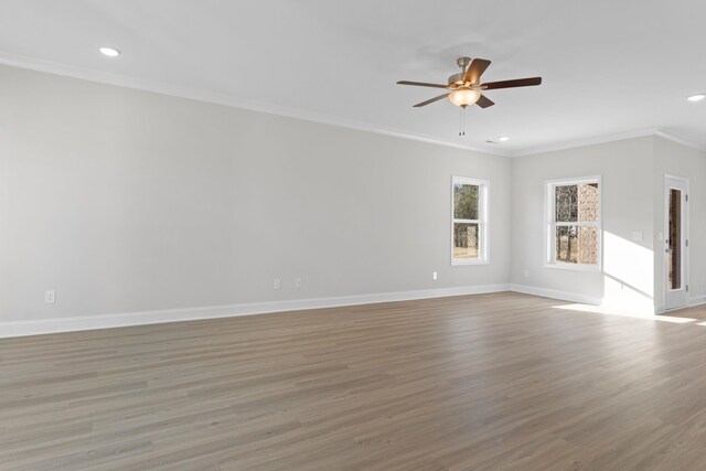 kitchen with decorative light fixtures, a center island with sink, stainless steel appliances, and light wood-type flooring