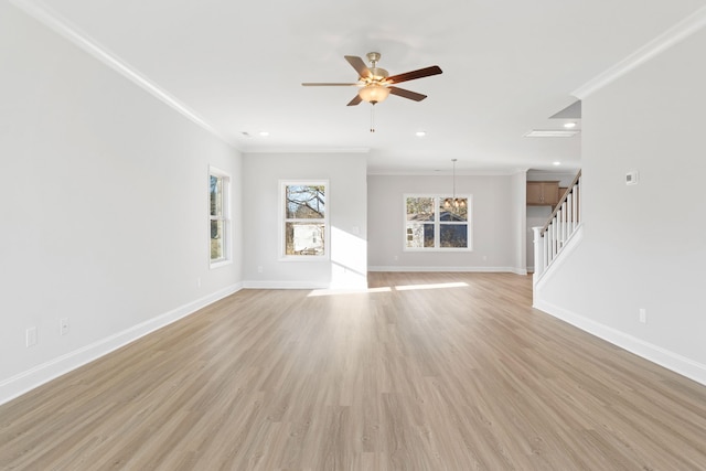 unfurnished living room featuring stairs, ornamental molding, light wood-style flooring, and baseboards