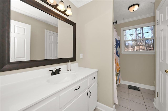 bathroom featuring baseboards, crown molding, vanity, and a textured ceiling