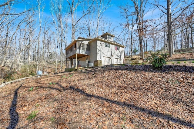 view of side of home with a garage