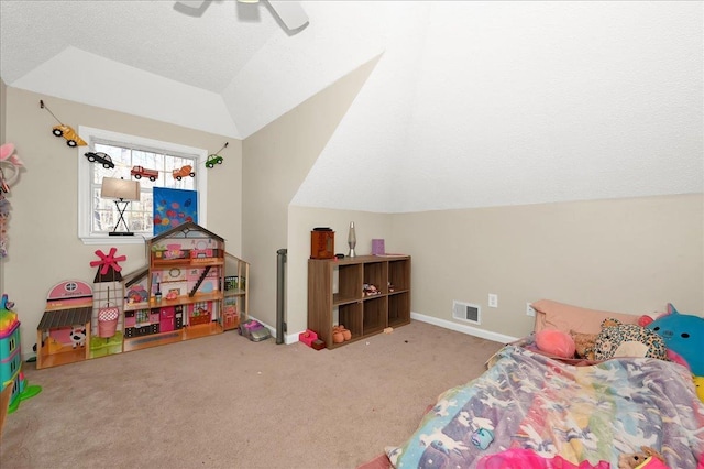 carpeted bedroom featuring lofted ceiling, visible vents, ceiling fan, and baseboards