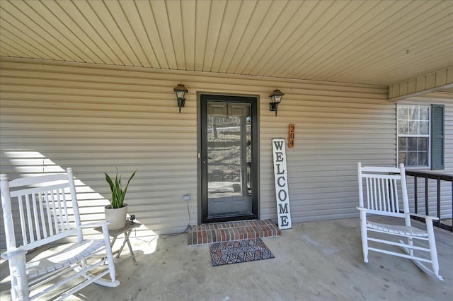 doorway to property featuring a porch