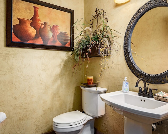  - bathroom with toilet and a sink