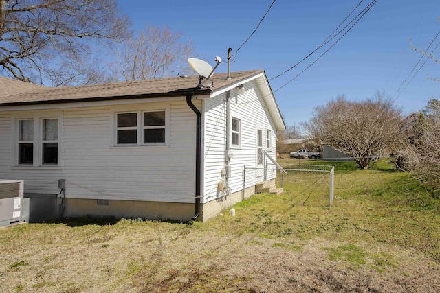 view of home's exterior featuring crawl space, fence, and a yard