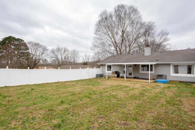 view of yard with central AC