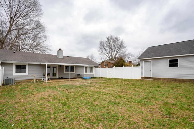 view of yard featuring a patio and central AC