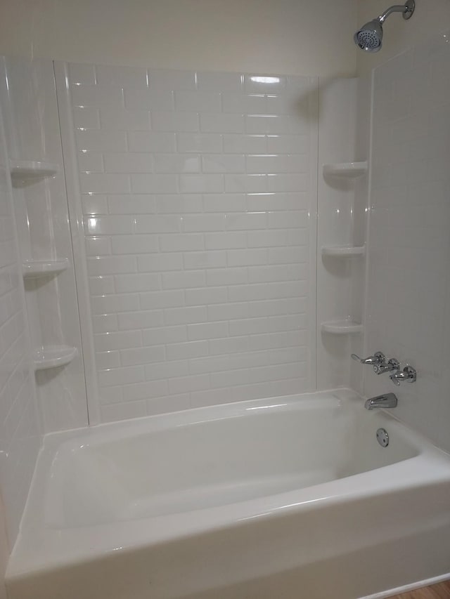 bathroom featuring washtub / shower combination