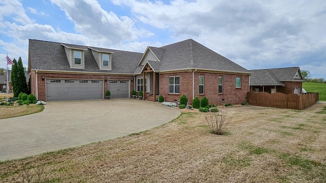 view of front of property featuring roof with shingles, concrete driveway, fence, brick siding, and a garage