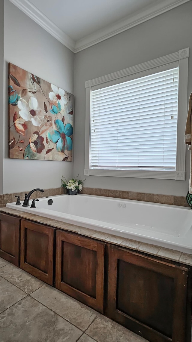 bathroom with crown molding, tile patterned flooring, and a garden tub
