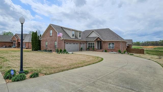 view of front of home featuring an attached garage, concrete driveway, a front yard, brick siding, and a shingled roof